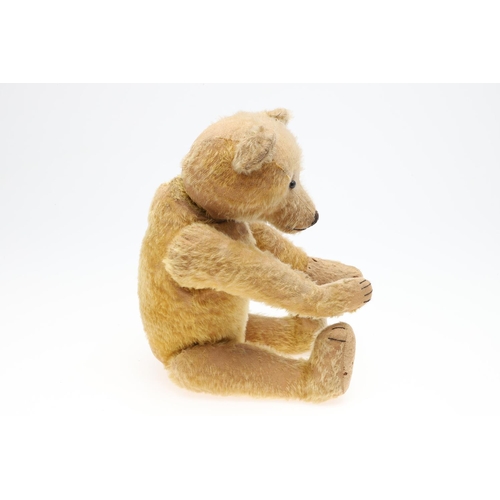 735 - EARLY STEIFF TEDDY BEAR. A large early Steiff Teddy Bear, with elongated limbs, hump back and growle... 