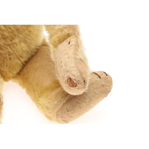 735 - EARLY STEIFF TEDDY BEAR. A large early Steiff Teddy Bear, with elongated limbs, hump back and growle... 