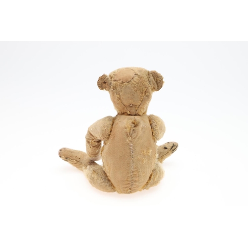 736 - EARLY STEIFF TEDDY BEAR. A small early 20thc Steiff Teddy Bear with elongated limbs, hump back and b... 