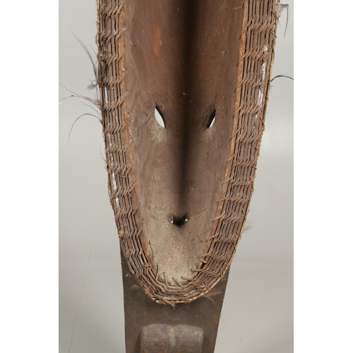 753 - LARGE AFRICAN TRIBAL MASK. An unsually large tribal mask, carved with various human and animal masks... 