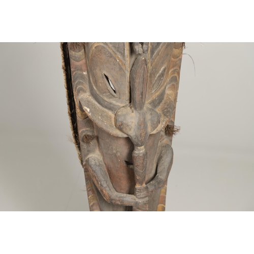 753 - LARGE AFRICAN TRIBAL MASK. An unsually large tribal mask, carved with various human and animal masks... 