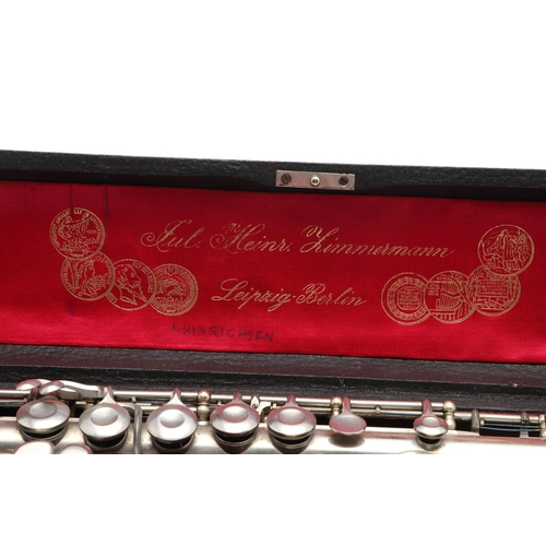 757 - JULIUS HEINRICH ZIMMERMANN OF LEIPZIG - CASED GERMAN FLUTE. An early 20thc three section nickel plat... 