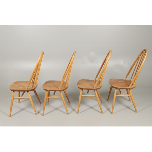 770 - VINTAGE ERCOL DINING TABLE & FOUR DINING CHAIRS. A large light elm and beech vintage Ercol dining ta... 