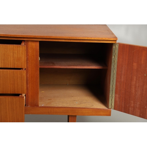 773 - MID CENTURY TEAK SIDEBOARD - BEAUTILITY. A large teak sideboard with a curved front, with three cent... 