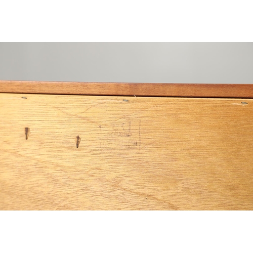 773 - MID CENTURY TEAK SIDEBOARD - BEAUTILITY. A large teak sideboard with a curved front, with three cent... 