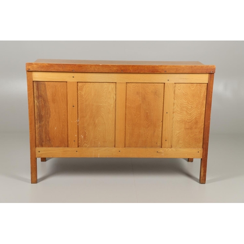 775 - HEALS - EARLY 20THC OAK SIDEBOARD. An early 20thc oak sideboard, with two central drawers with one w... 