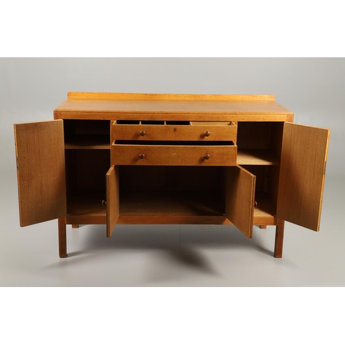 775 - HEALS - EARLY 20THC OAK SIDEBOARD. An early 20thc oak sideboard, with two central drawers with one w... 