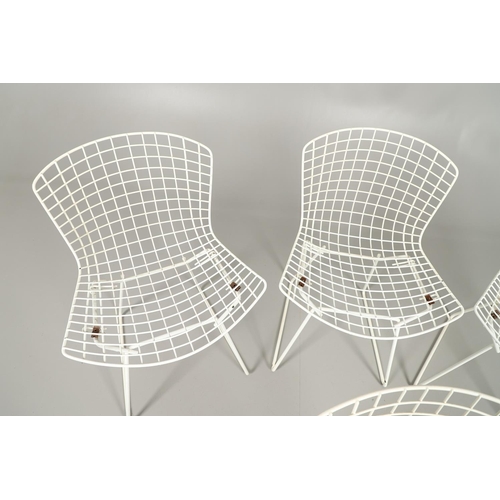 778 - HARRY BERTOIA - SET OF FOUR DESIGNER WIRE WORK CHAIRS. A set of four mid 20thc wire work chairs with... 