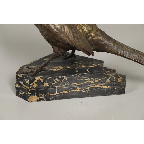 799 - LARGE BRONZE SCULPTURE OF A PHEASANT. In the style of Jules Moigniez, the large figure of a pheasant... 