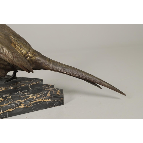 799 - LARGE BRONZE SCULPTURE OF A PHEASANT. In the style of Jules Moigniez, the large figure of a pheasant... 