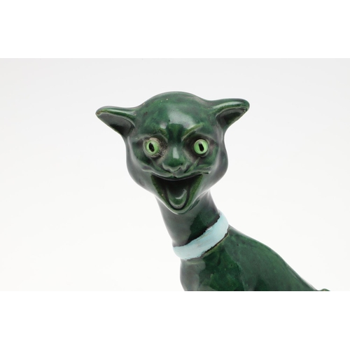 802 - ART POTTERY CAT. Possibly by Brannam, with green glass eyes elongated neck and green glaze. Unmarked... 