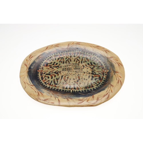 806 - ATTRIBUTED TO SIR GRAYSON PERRY (B 1960) - POTTERY DISH, 1988. An oval pottery dish, incised to the ... 