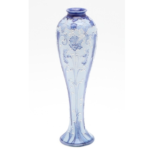 812 - WILLIAM MOORCROFT - MACINTYRE & CO FLORIAN WARE VASE. The vase of slender form, painted with tube li... 