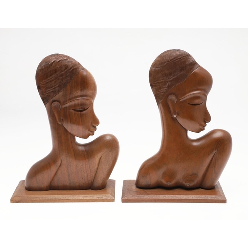 813 - CARVED AFRICAN STYLE BUSTS - IN THE STYLE OF KARL HAGENAUER. In the style of Karl Hagenauer, a pair ... 