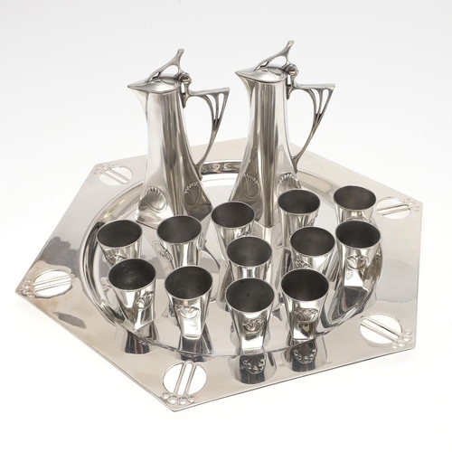 826 - WMF LIQUEUR SET & TRAY. Circa 1900 with a hexagonal shaped tray with a stylised pierced rim, with tw... 