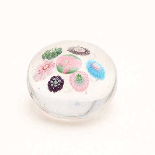 835 - 19THC CLICHY GLASS PAPERWEIGHT. Circa 1850, the small cane paperweight with seven flower heads inclu... 