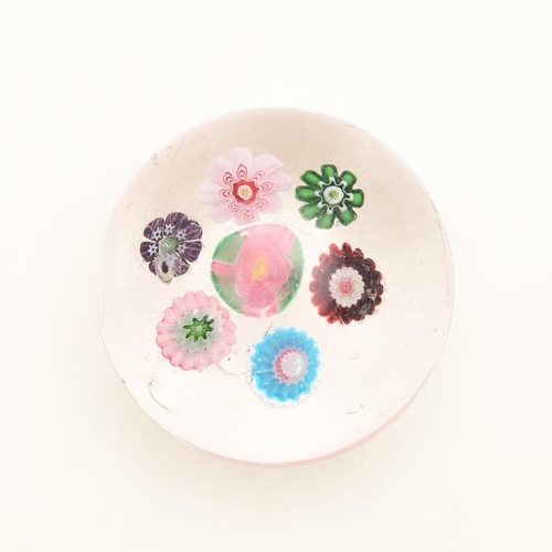 835 - 19THC CLICHY GLASS PAPERWEIGHT. Circa 1850, the small cane paperweight with seven flower heads inclu... 