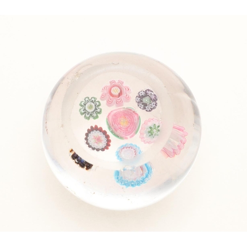 835 - 19THC CLICHY GLASS PAPERWEIGHT. Circa 1850, the small cane paperweight with seven flower heads inclu... 