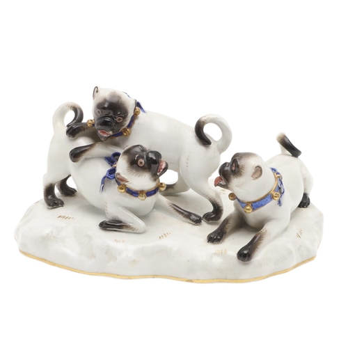 837 - MEISSEN PORCELAIN PUG GROUP. A late 19thc porcelain group of three Pug Dogs at play, each with blue ... 