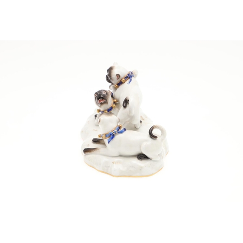 837 - MEISSEN PORCELAIN PUG GROUP. A late 19thc porcelain group of three Pug Dogs at play, each with blue ... 