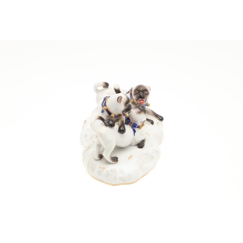 837 - MEISSEN PORCELAIN PUG GROUP. A late 19thc porcelain group of three Pug Dogs at play, each with blue ... 