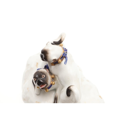 837 - MEISSEN PORCELAIN PUG GROUP. A late 19thc porcelain group of three Pug Dogs at play, each with blue ... 