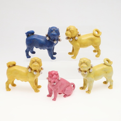 839 - PORCELAIN MODELS OF PUG DOGS. Including a pair of yellow glazed porcelain models of standing Pug dog... 