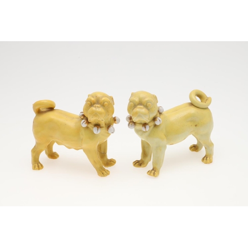 839 - PORCELAIN MODELS OF PUG DOGS. Including a pair of yellow glazed porcelain models of standing Pug dog... 