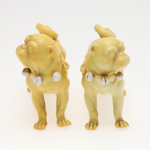 839 - PORCELAIN MODELS OF PUG DOGS. Including a pair of yellow glazed porcelain models of standing Pug dog... 