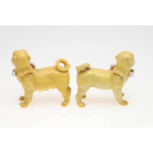 839 - PORCELAIN MODELS OF PUG DOGS. Including a pair of yellow glazed porcelain models of standing Pug dog... 