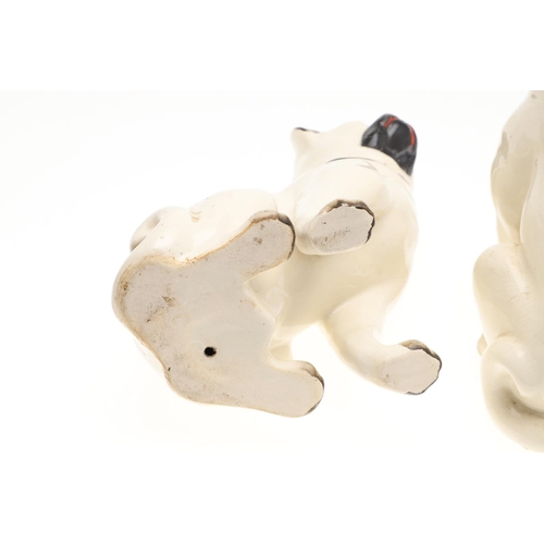 842 - TWO PAIRS OF POTTERY PUG DOGS & WINSTANLEY PUG. Two pairs of seated pottery Pug Dogs, each painted w... 