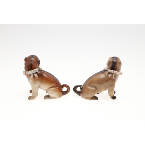 843 - PORCELAIN MODELS OF PUG DOGS. Including a Meissen style porcelain model of a seated Pug (17.5cms hig... 