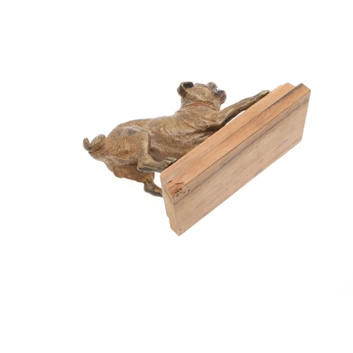 844 - COLD PAINTED BRONZE PUG & PUG RELATED ITEMS. A cold painted model of a crouching Pug Dog, the figure... 