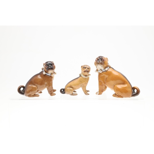 845 - PORCELAIN MODELS OF PUG DOGS. A mixed group of six various porcelain Pug Dogs, the largest standing ... 