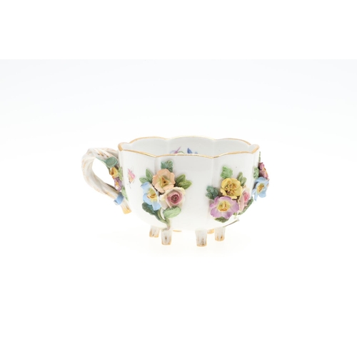 853 - MEISSEN CUP & SAUCER, & SIMILAR CUP & SAUCER. A Meissen cup and saucer, painted with a variety of fl... 