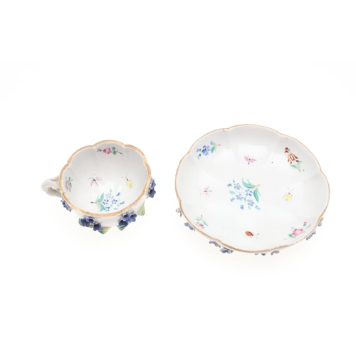 853 - MEISSEN CUP & SAUCER, & SIMILAR CUP & SAUCER. A Meissen cup and saucer, painted with a variety of fl... 