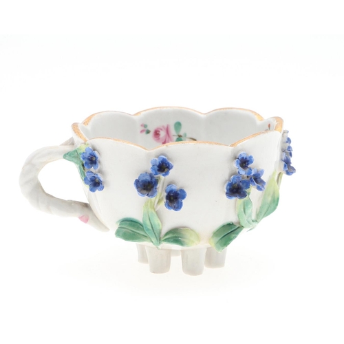 853 - MEISSEN CUP & SAUCER, & SIMILAR CUP & SAUCER. A Meissen cup and saucer, painted with a variety of fl... 