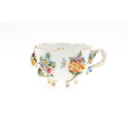 853 - MEISSEN CUP & SAUCER, & SIMILAR CUP & SAUCER. A Meissen cup and saucer, painted with a variety of fl... 