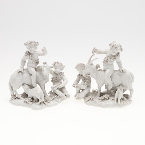 861 - PAIR OF VIENNA STYLE PORCELAIN FIGURE GROUPS. A pair of blanc de chine figure groups, with cherub fi... 