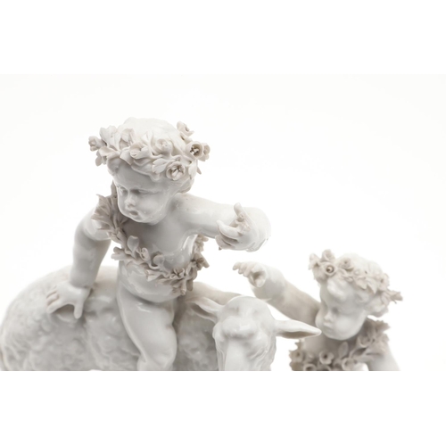 861 - PAIR OF VIENNA STYLE PORCELAIN FIGURE GROUPS. A pair of blanc de chine figure groups, with cherub fi... 