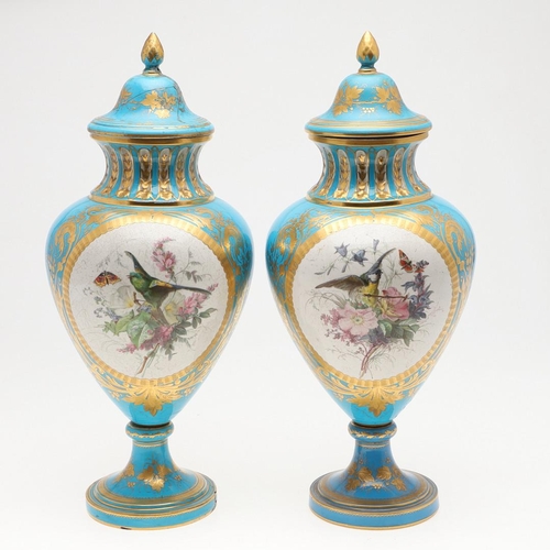 864 - LARGE PAIR OF SEVRES STYLE LIDDED VASES. A large pair of 19thc Sevres style lidded vases, with a pan... 