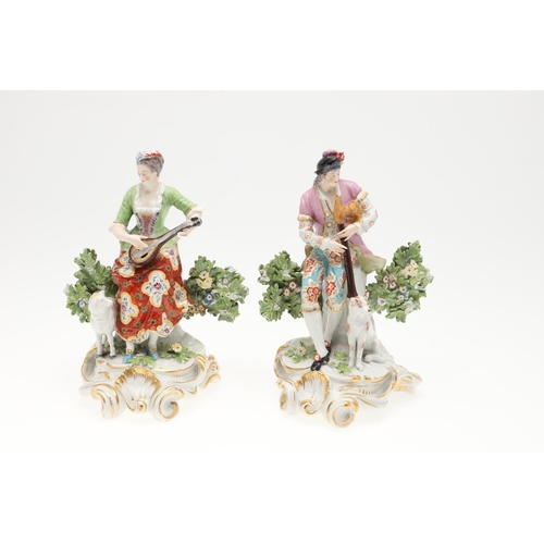 869 - LARGE PAIR OF CHELSEA STYLE PORCELAIN FIGURES. A pair of continental figures of a lady and gent play... 