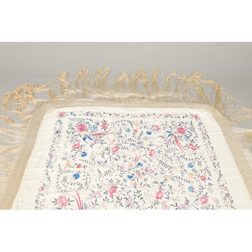 876 - CHINESE SILK EMBROIDERED SHAWL. A late 19thc/early 20thc large cream silk shawl, the square panel he... 