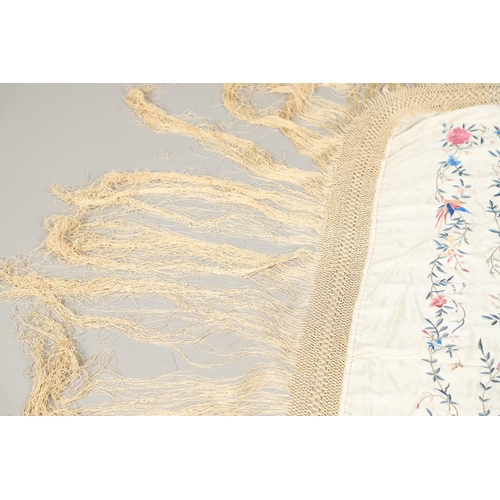 876 - CHINESE SILK EMBROIDERED SHAWL. A late 19thc/early 20thc large cream silk shawl, the square panel he... 