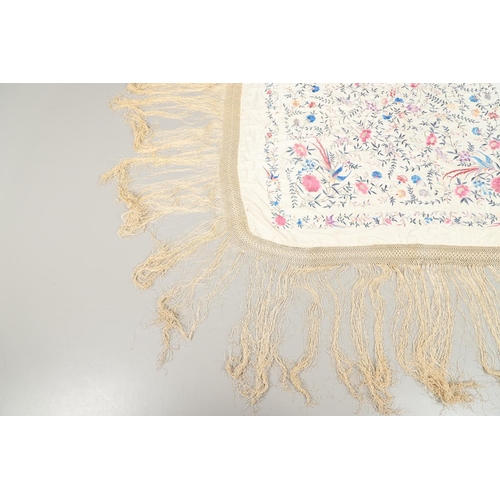 876 - CHINESE SILK EMBROIDERED SHAWL. A late 19thc/early 20thc large cream silk shawl, the square panel he... 