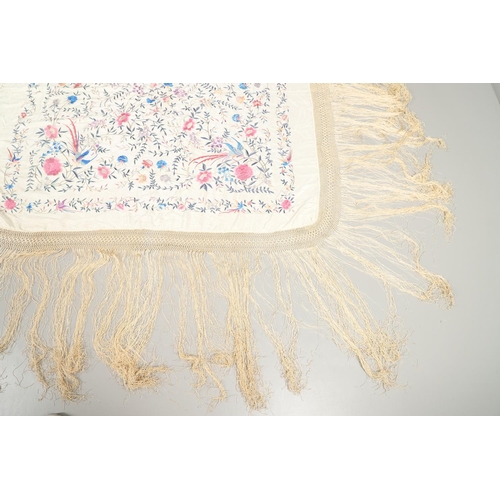 876 - CHINESE SILK EMBROIDERED SHAWL. A late 19thc/early 20thc large cream silk shawl, the square panel he... 