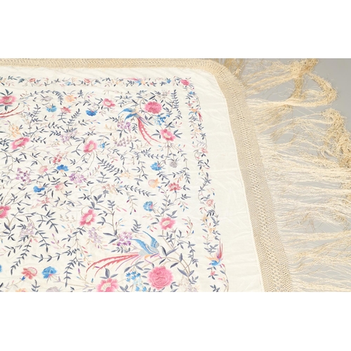 876 - CHINESE SILK EMBROIDERED SHAWL. A late 19thc/early 20thc large cream silk shawl, the square panel he... 