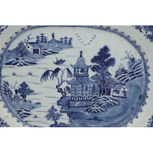 955 - 18THC CHINESE EXPORT BLUE & WHITE PLATTER. An 18thc platter of rectangular canted shape, painted wit... 