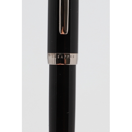 1533 - A SHEAFFER LEGACY FOUNTAIN PEN. the black case with gold plated trim and white dot to cap, 18k nib; ... 