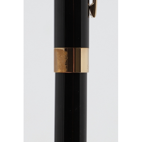 1533 - A SHEAFFER LEGACY FOUNTAIN PEN. the black case with gold plated trim and white dot to cap, 18k nib; ... 